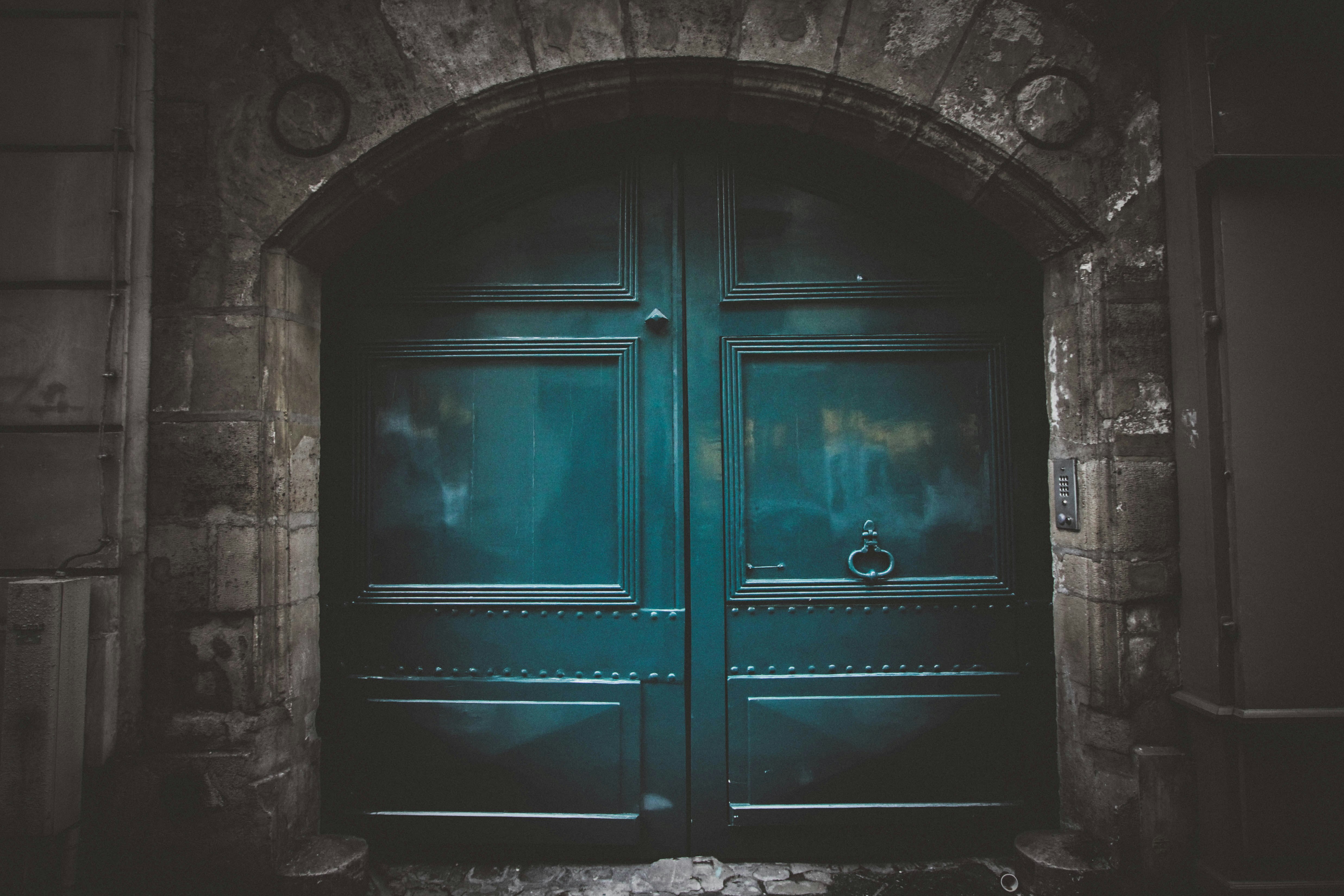 blue wooden double arch door s